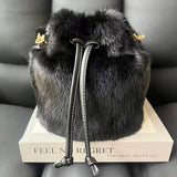Real mink fur bucket handbag for women, luxurious fluffy crossbody bag with evening style, by HSF Marketplace.