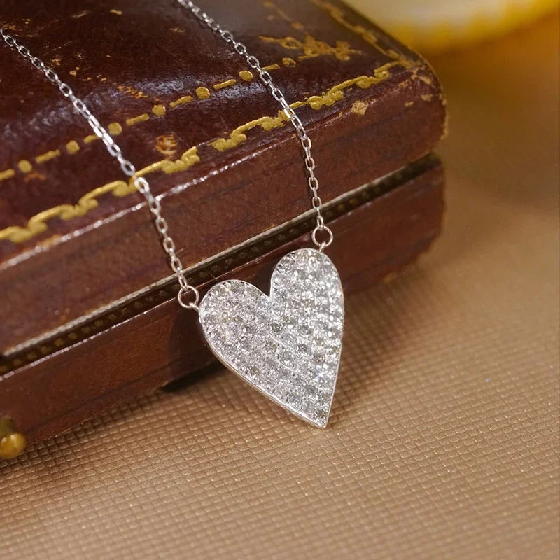 Huitan heart pendant necklace with sparkling CZ stones for women, delicate jewelry design