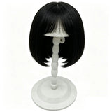 White plastic wig stand with a mushroom top, portable and foldable, ideal for displaying short wigs and hair styling.