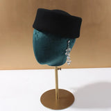 Women's vintage wool felt beret hat with hard concave top, pillbox design, and wedding fascinator style