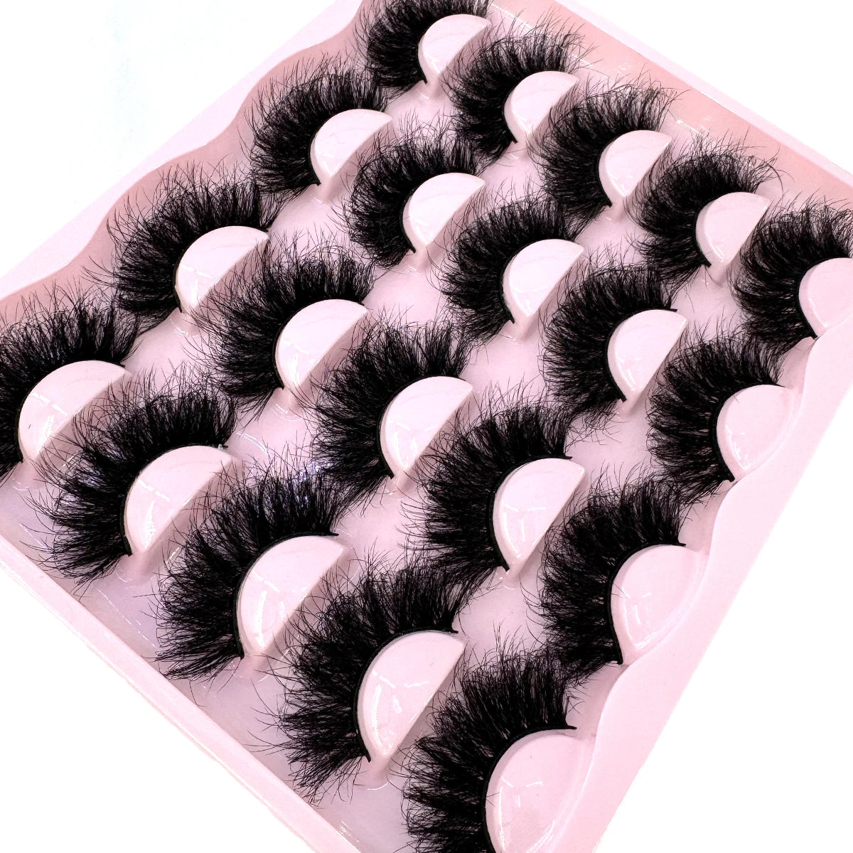 Set of 10 pairs of 25mm wispy faux mink lashes with thick, dramatic volume and cat-eye style for glamorous makeup looks.