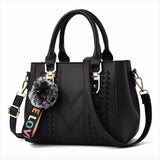 Leather embroidery messenger handbag for women with hair ball detail, stylish HSF Marketplace purse for daily use.