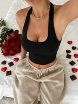 Women's sleeveless backless vest top in solid color, casual and elegant design by HSF Marketplace, ideal for summer wear.