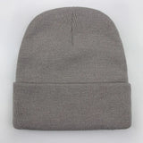 Unisex soft knitted winter beanie in women's hat style, available in 24 colors