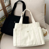 Large capacity canvas tote bag by HSF Marketplace, stylish shoulder bag for work, college, and commuting with ample space for books.