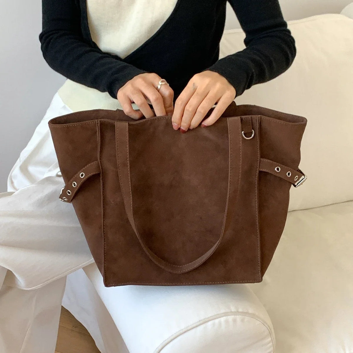 Black Rivet Design women’s shoulder handbag with large capacity, elegant office style, featuring brand details and spacious interior.