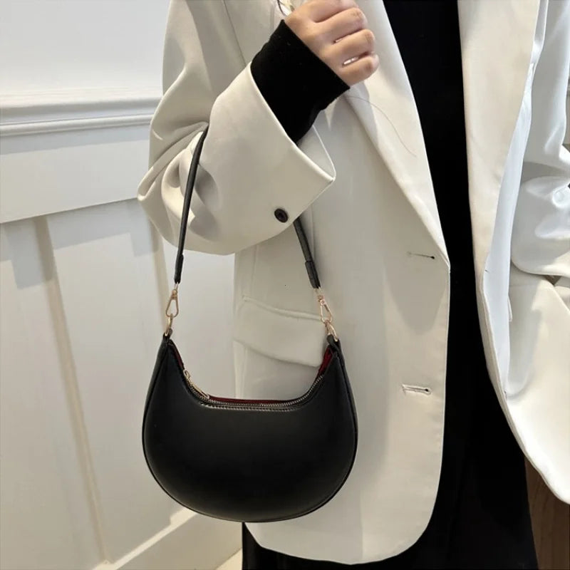 Luxury moon-shaped women's handbag by HSF Marketplace, elegant high-end purse with single shoulder strap for stylish ladies.