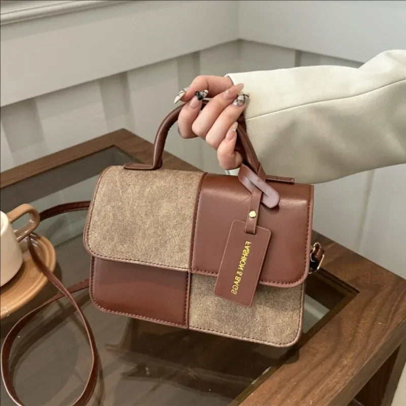 Elegant women's crossbody handbag by HSF Marketplace featuring a geometric pattern and snap closure, ideal for everyday fashion.