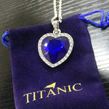 Titanic Heart of Ocean blue heart pendant necklace by HSF Marketplace, displayed with a velvet gift bag.