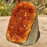 Orange quartz crystal cluster from HSF Marketplace, featuring vibrant mineral stones suitable for home or office decorative display.