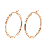 Classic stainless steel hoop earrings for women, available in 30–80mm sizes