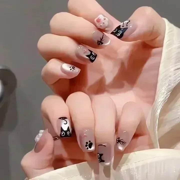 24pcs cute girly short square false nails with white French tips, glitter stars, rhinestones, cat eye, and bow art