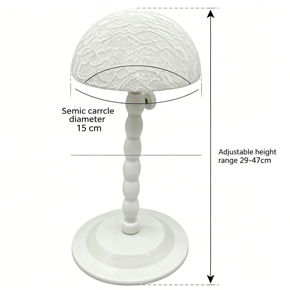 White plastic wig stand with mushroom top, portable and foldable hair styling tool for displaying short wigs and toupees.