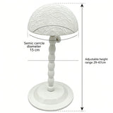 White plastic wig stand with mushroom top, portable and foldable hair styling tool for displaying short wigs and toupees.