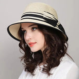 Muchique women's straw boater hat with wide brim and casual bow for summer beach travel