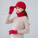 Warm knitted women’s winter hat, scarf and gloves set in a coordinated design for cold-weather comfort