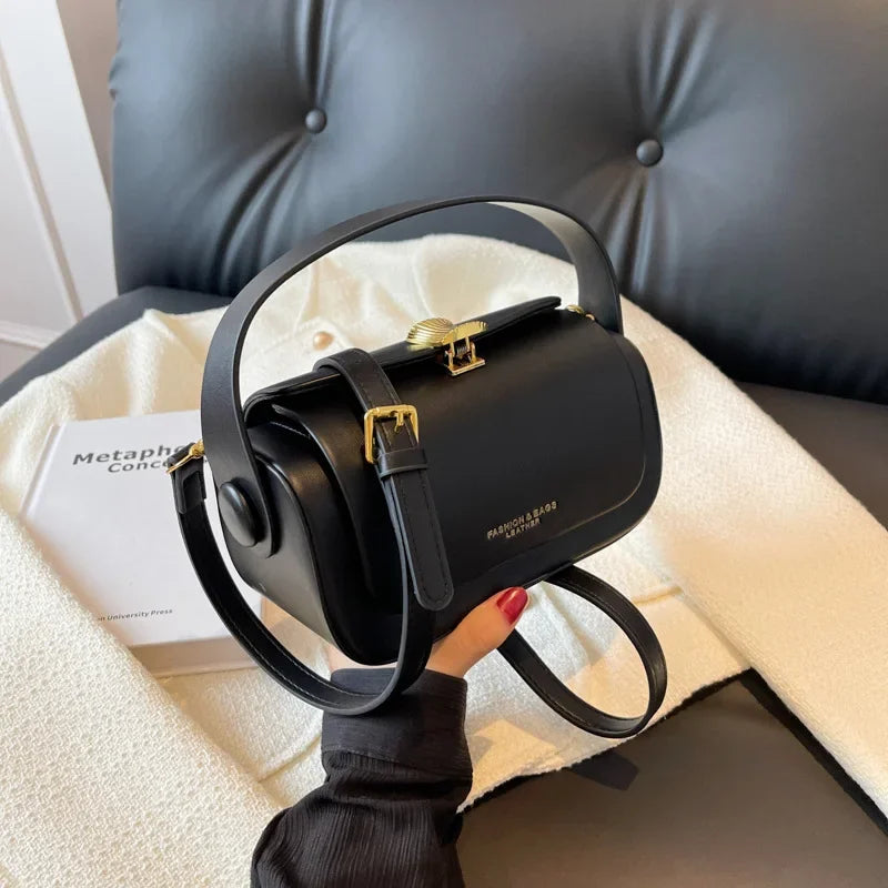 Black leather shoulder bag by HSF Marketplace featuring a textured flap, square design, large capacity, and versatile retro style.