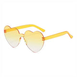 Pink love heart-shaped sunglasses for women with big frames, vintage style, UV400 protection, outdoor fashion eyewear by HSF Marketplace.