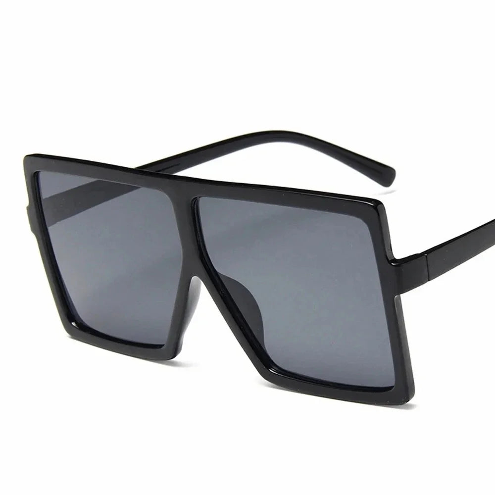 Square women's sunglasses with clear lenses, plastic frame, UV400 protection, fashionable driving eyewear by HSF Marketplace.