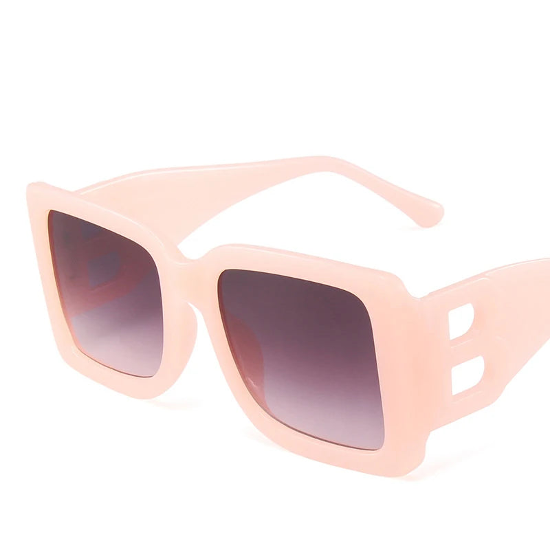 Black luxury women's sunglasses with square frames, trendy designer shades, UV400 protection, and retro style.