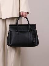 Vintage women's handbag by HSF Marketplace featuring a soft leather flap messenger style for office and commute.