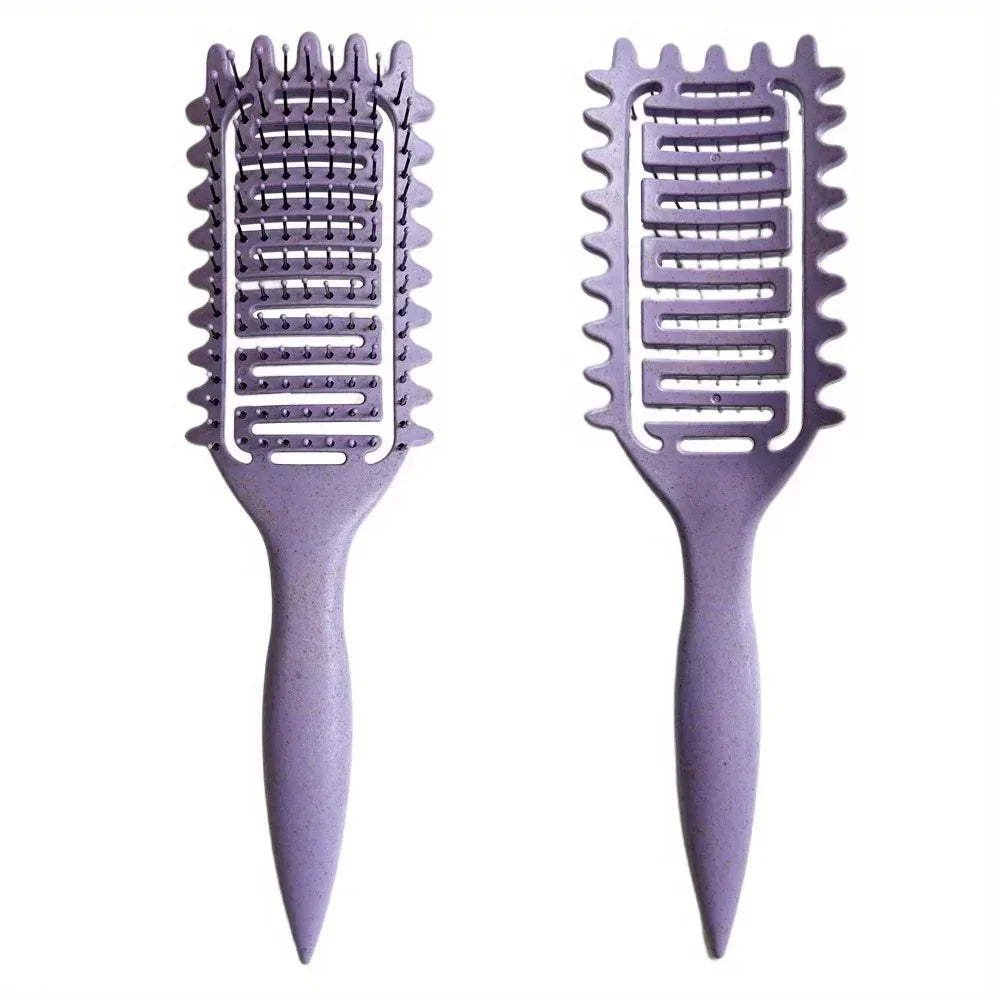Hollow boar bristle curling and detangling hair styling brush with ergonomic handle for shaping and defining curls.