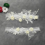 2-piece bridal garter thigh belt with pearl flower embroidery and elastic leg loops for weddings and parties