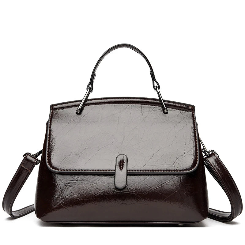 Elegant black leather shoulder bag for women, featuring a small crossbody design with a stylish, high-quality finish.