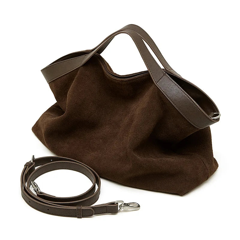 Genuine leather women's handbag with large capacity, shoulder and crossbody styles, featuring cowhide material and spacious tote design.