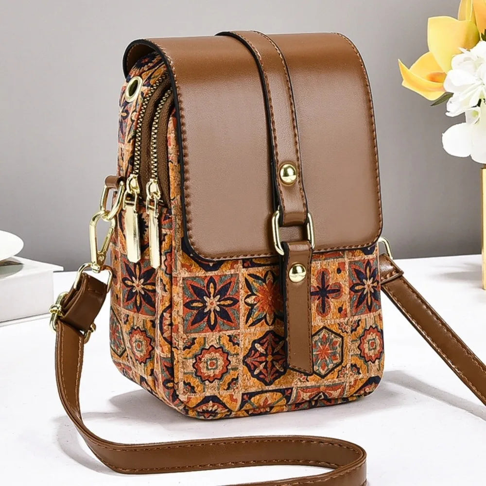 Bohemian printed PU leather phone bag with ethnic design, versatile crossbody style, suitable for ladies.