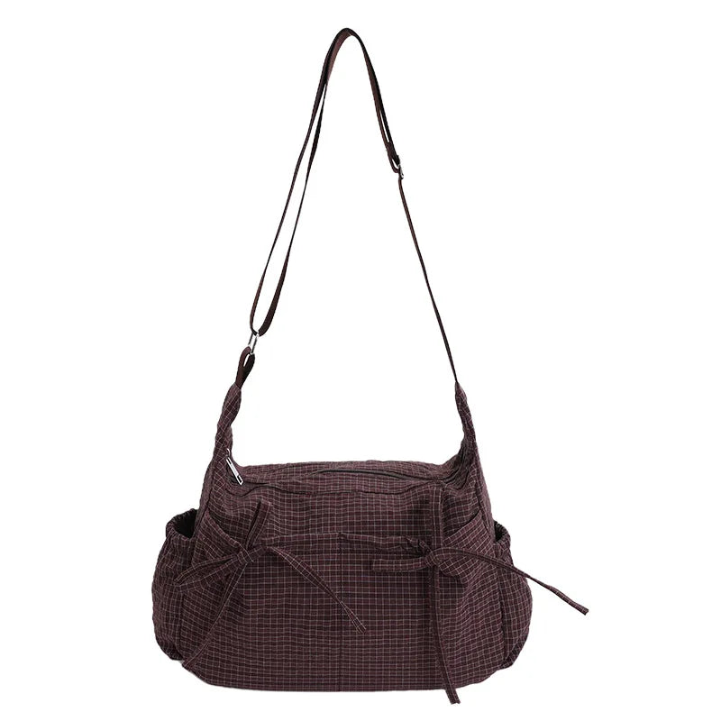 Women checkered nylon sling bag with drawstring, large capacity trendy crossbody handbag for shopping or casual outings.