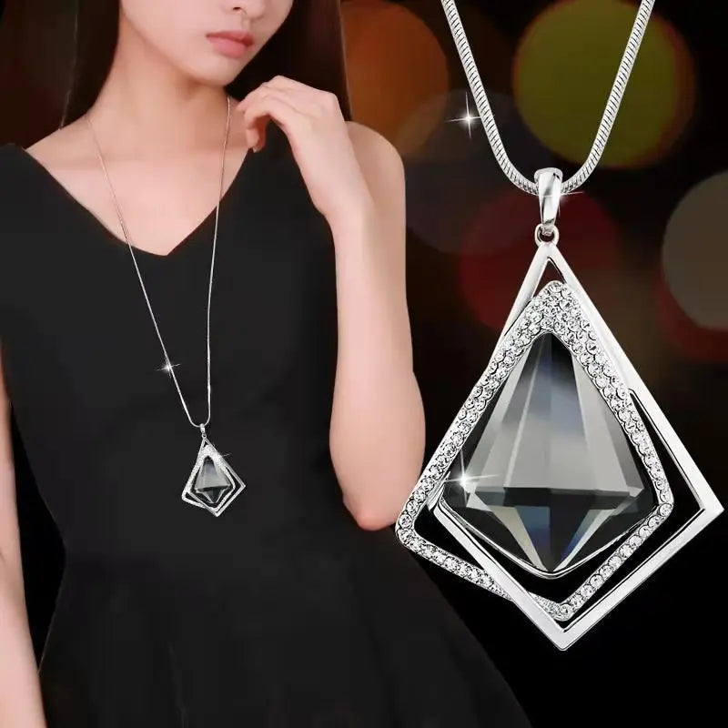 Fashion geometric crystal pendant necklace for women featuring long chain, pearl accents, and statement jewelry design.