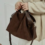 Genuine leather women's handbag with large capacity, shoulder and crossbody styles, featuring cowhide design and spacious tote.