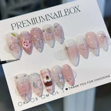 24-piece pink almond false nail tips with bowknot, love heart, and pearl designs by HSF Marketplace