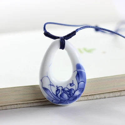 Close-up of women's ceramic fashion necklace with pendant from HSF Marketplace, showcasing intricate design and stylish jewelry for women.