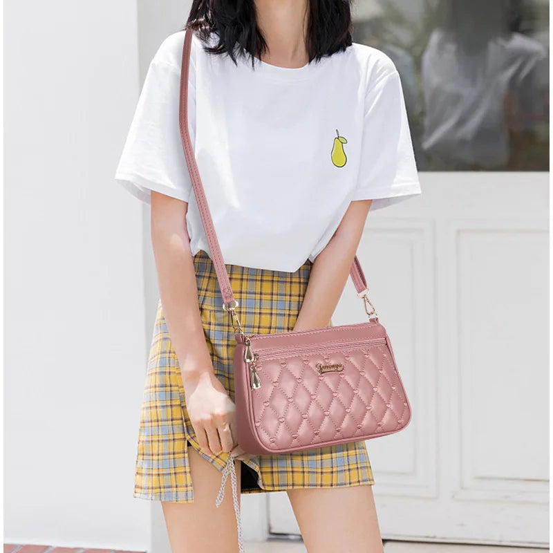 Leather crossbody handbag with embroidery thread detail, zipper closure, and spacious interior for women’s fashion purse by HSF Marketplace.