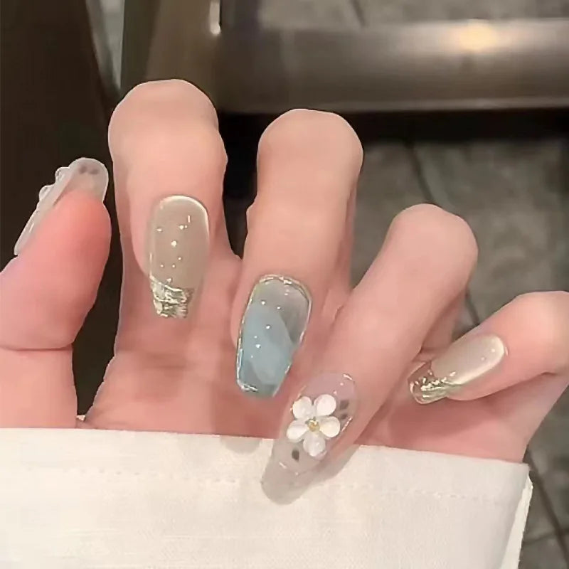 24-piece Y2K star press-on false nails with gradient blue French tips and gold moon designs, almond shape