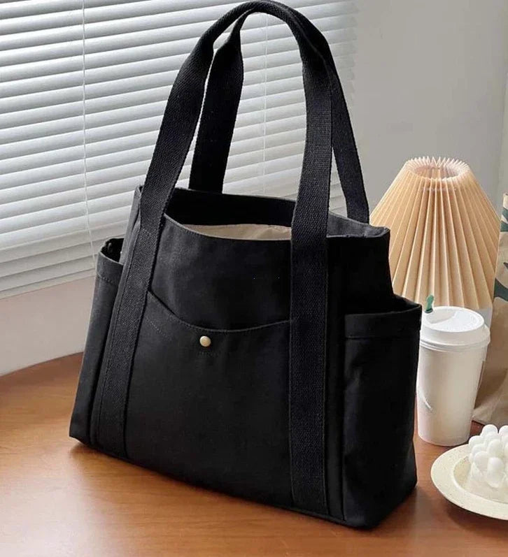 Large capacity canvas tote bag by HSF Marketplace, stylish shoulder bag for work, college, and commuting with room for books and essentials.