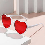 Pink love heart-shaped sunglasses for women with large frames, vintage style, UV400 protection, outdoor fashion eyewear.