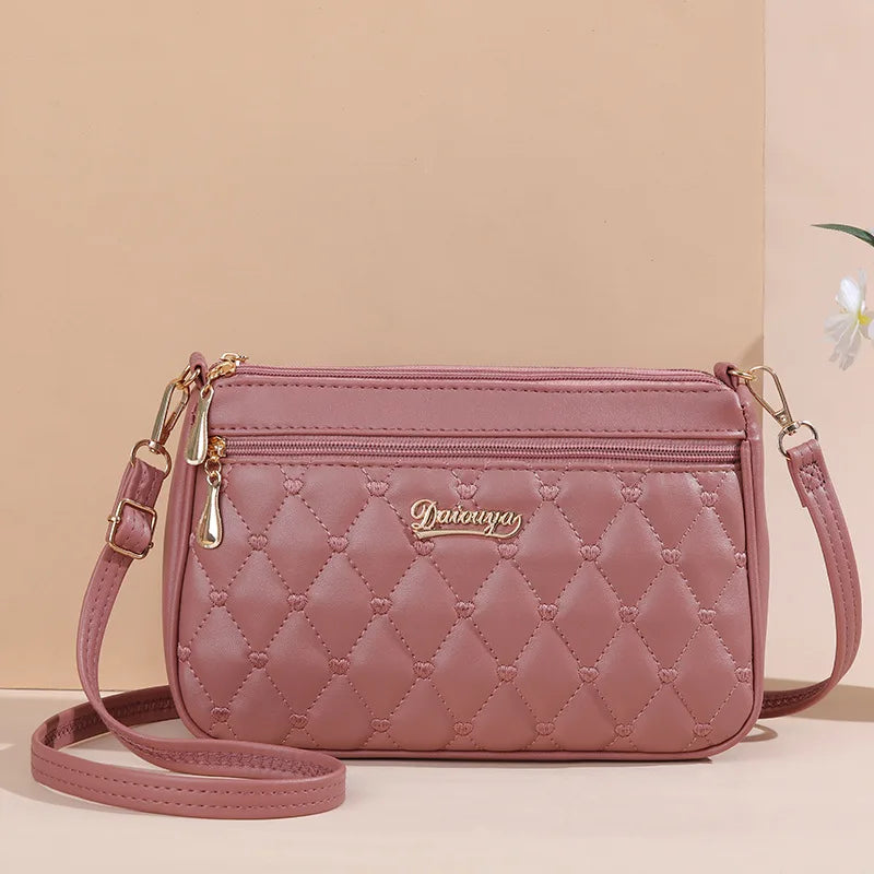 HSF Marketplace women's PU leather crossbody handbag with zipper, embroidery thread detail, large capacity, and stylish shoulder strap.