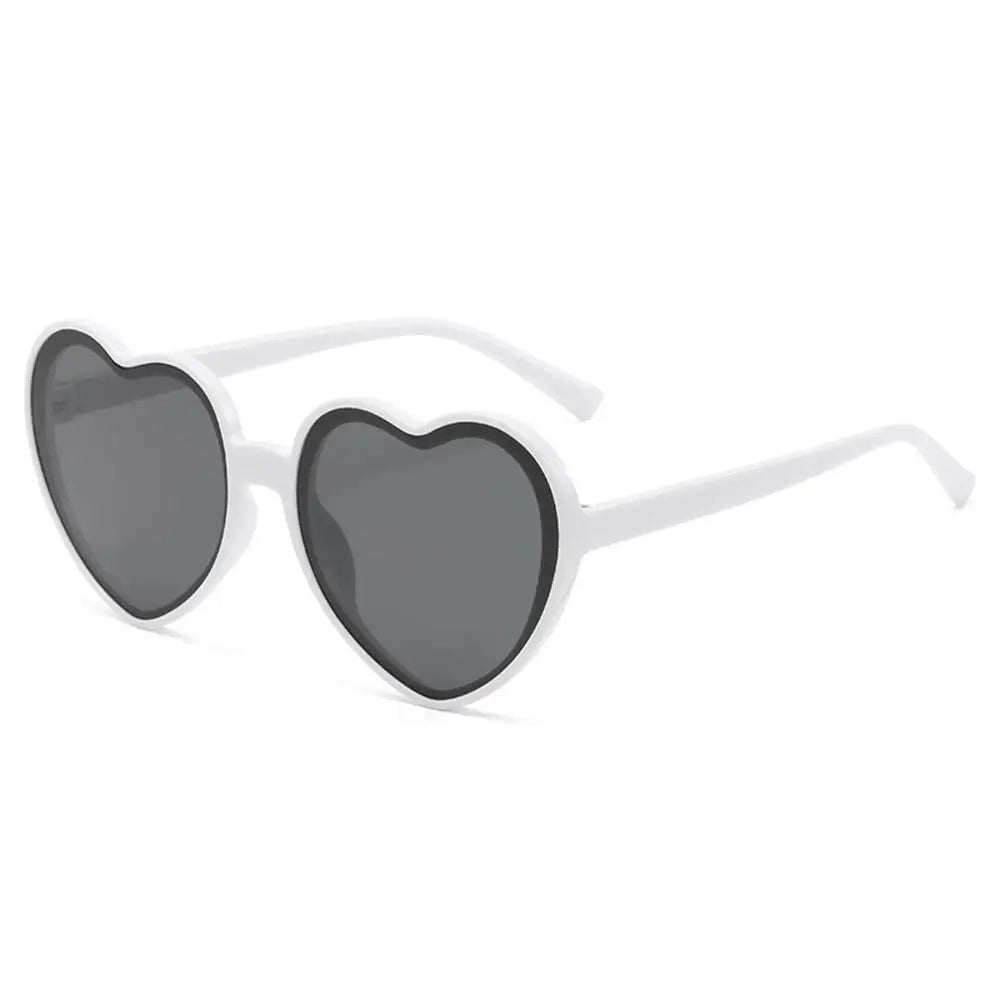 Pink love heart-shaped sunglasses for women with big frames, vintage style, UV400 protection, outdoor fashion eyewear by HSF Marketplace.