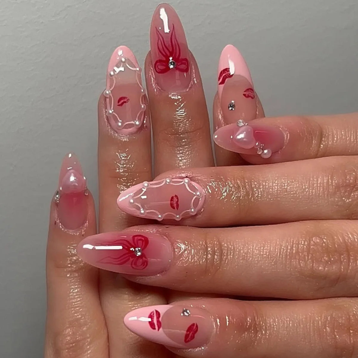 24-piece pink almond false nail tips with bowknots, love hearts and pearl design by HSF Marketplace