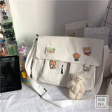 Women’s casual messenger handbag by HSF Marketplace featuring printed canvas, shoulder strap, and interior pouch for everyday use.