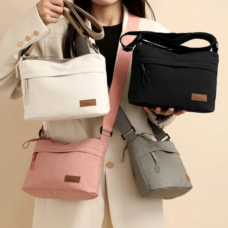 HSF Marketplace women's canvas shoulder crossbody bag with three main pockets, high capacity multi-pocket purse for mothers and shopping.
