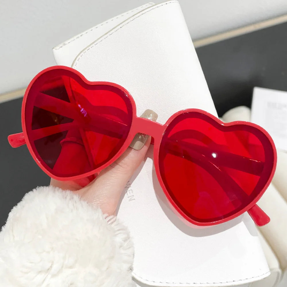Pink love heart-shaped sunglasses for women with big frames, vintage style, UV400 protection, outdoor fashion eyewear from HSF Marketplace.