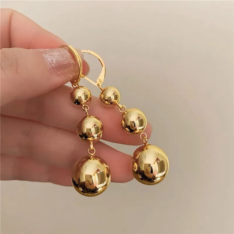 Gold color punk metal round bead tassel pendant earrings with glossy smooth ball design for women