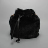 Real mink fur bucket handbag for women, luxury fluffy crossbody bag with evening style, perfect for winter fashion.