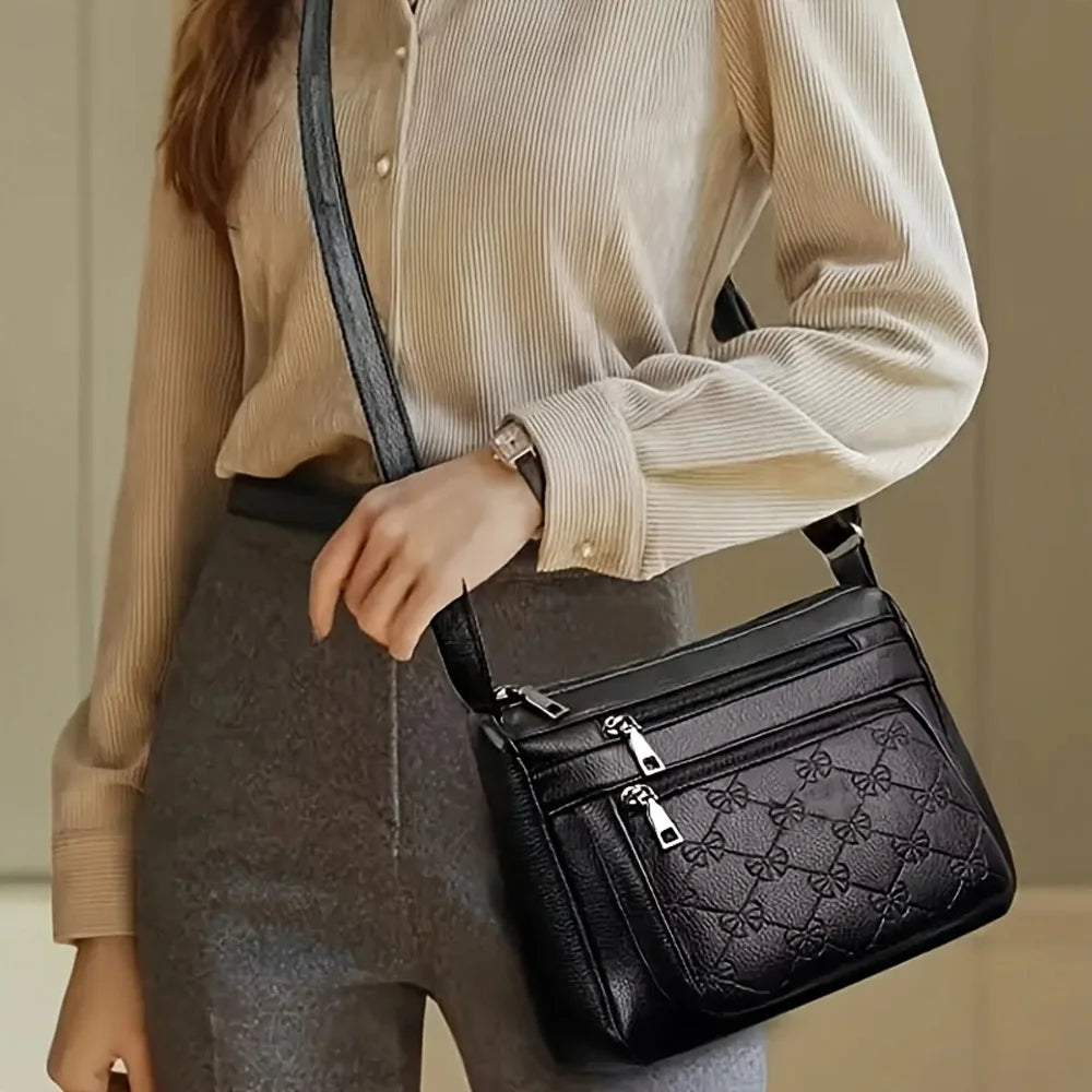 Black embossed women’s crossbody handbag by HSF Marketplace with multiple pockets and large capacity for outings and parties.