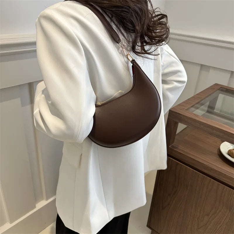 Luxury moon-shaped women's handbag by HSF Marketplace, elegant high-end shoulder bag with stylish design and premium craftsmanship.