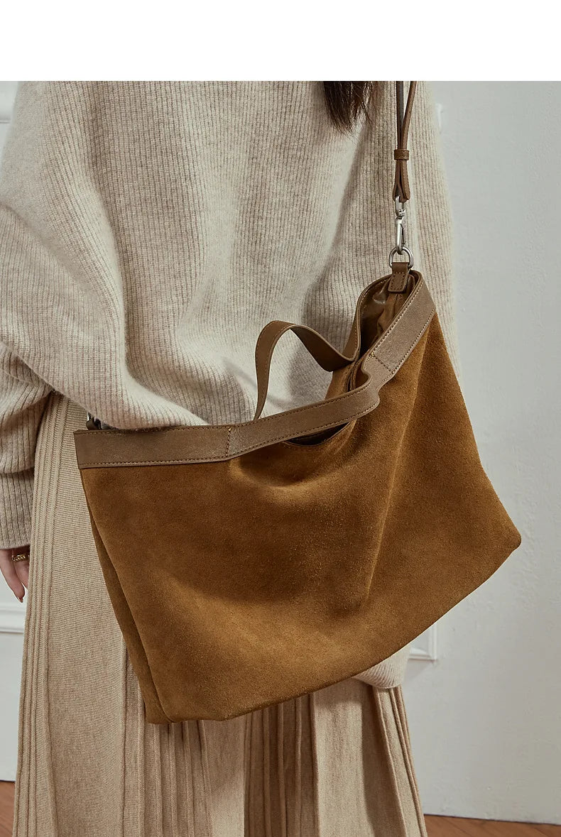 Genuine leather women's handbag with large capacity, shoulder and crossbody style, fashion cowhide tote for commuting and daily use.